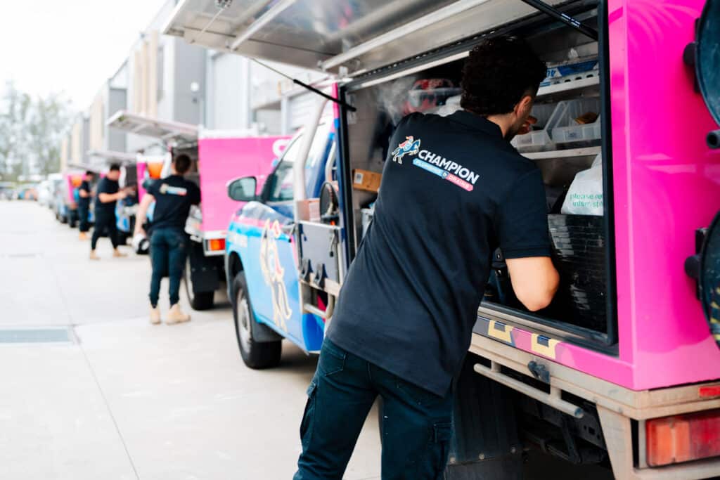 Plumber unloading equipment from service van