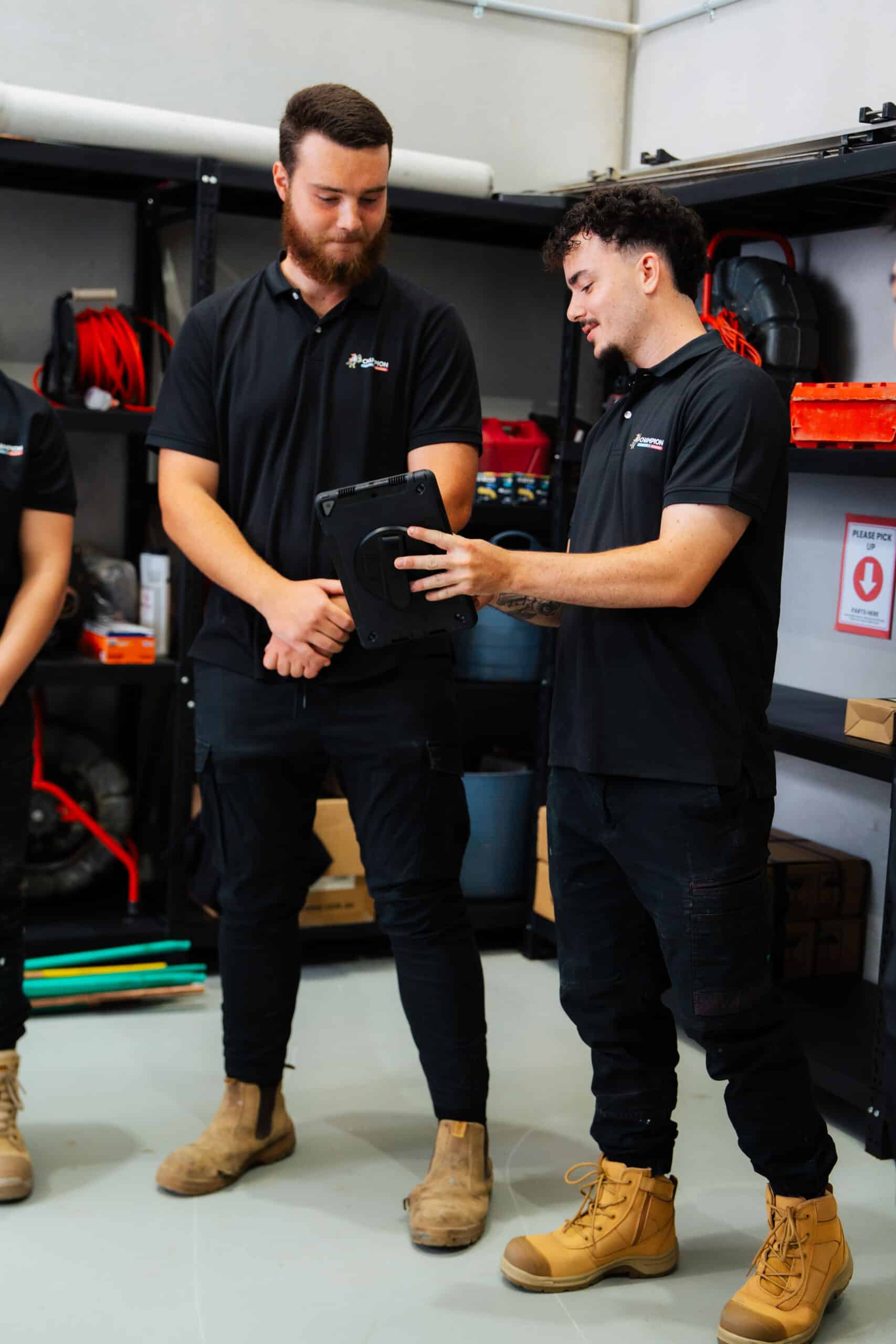 Branded pink and blue service van parked at property