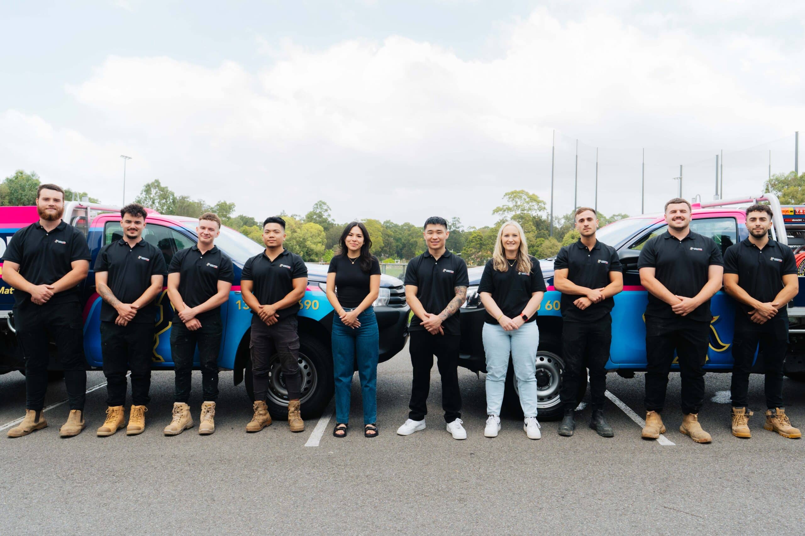 Full team lined up in branded uniforms