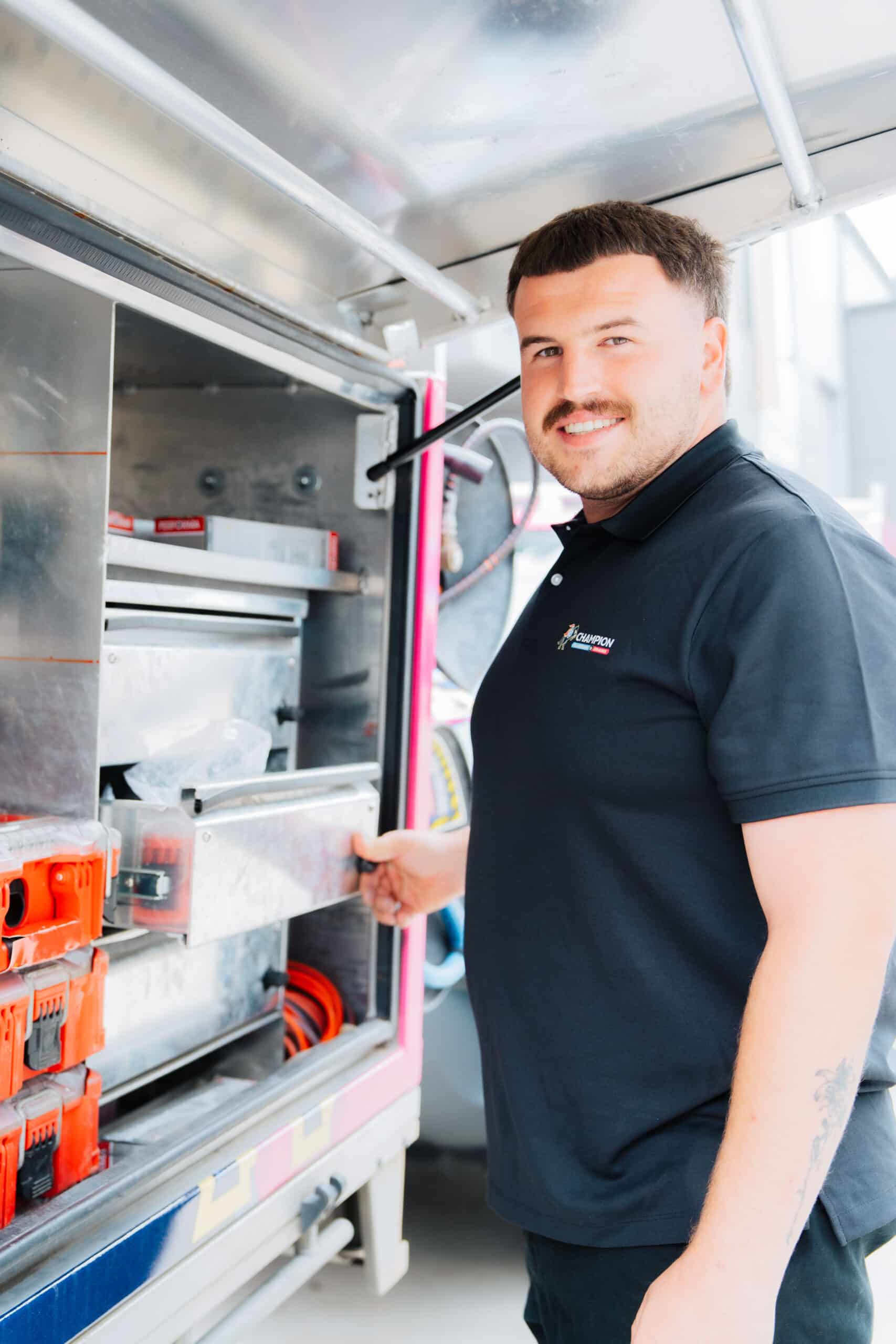 Plumber working on vertical pipe installation