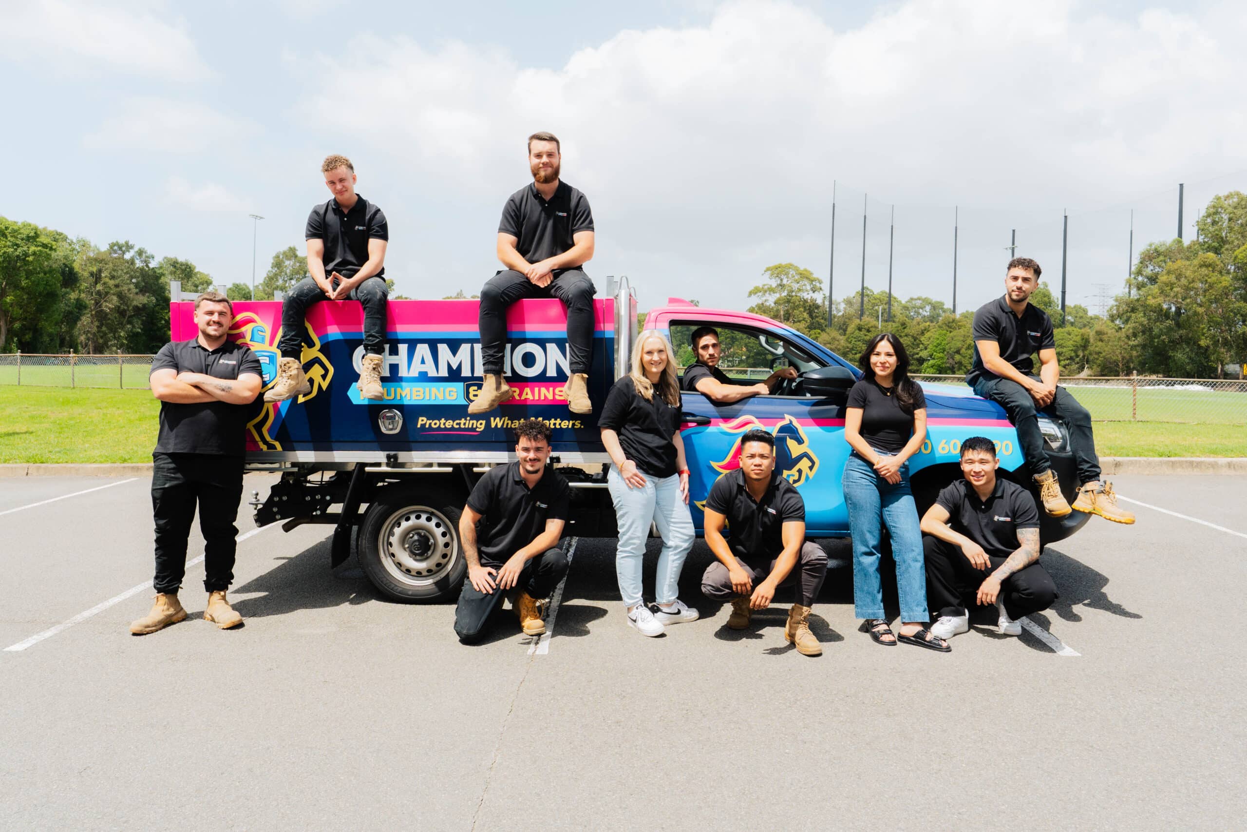 Full plumbing team photo outside residential property