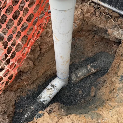 New PVC sewer pipe and inspection riser replacing collapsed clay sewer pipework in Lilyfield